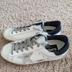 This is a BRAND NEW pair of Golden Goose Superstar shoes.
